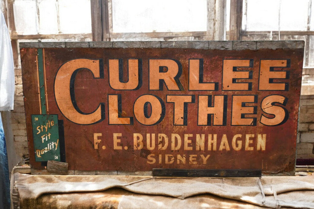 "Curlee Clothes' Metal Sign